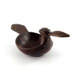 A Scandinavian folk art carved wooden drinking bowl, in the form of a bird