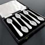 A set of six mother of pearl caviar spoons