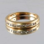 An 18 carat gold channel set diamond ring