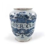 A London Delft pill jar, ovoid form, circa 1720, decorated in blue with a scrolling strapwork label