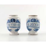 A pair of Southwell Delft pill jars, ovoid form, circa 1680, decorated in blue with a scrolling stra