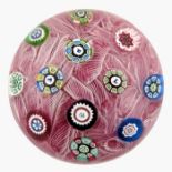 Perthshire, two spaced millefiori paperweights with silhouettes on muslin