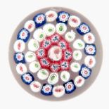 Baccarat, concentric millefiori paperweight, central complex millefiori cog cane, surrounded red by
