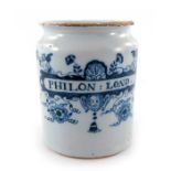 A London Delft pill jar, cylinder form, circa 1760, decorated in blue with a scrolling strapwork lab
