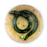 William Manson, a snake paperweight, a green and yellow snake set on a sandy ground, signature cane