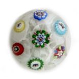 Baccarat, spaced millefiori paperweight set with seven individual canes, including three Gridel silh