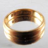 A 22 carat gold wedding ring,