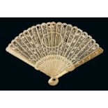 A Chinese child's carved ivory brise fan, 19th century