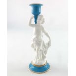 A Paris porcelain figural candlestick