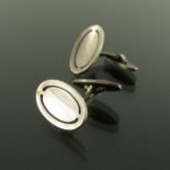 Poul Hansen for Georg Jensen, a pair of Modernist silver cufflinks, model 75A, oval form with incise