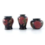 William Moorcroft, three small Pomegranate vases