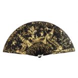 A Chinese black lacquer brisé fan, later Qing Dynasty, decorated to the recto and guards with gold,