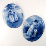 A pair of Royal Doulton blue children plaques