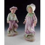A pair of Gebruder Heubach bisque figures of playing children