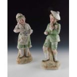 A pair of Gebruder Heubach bisque figures of children