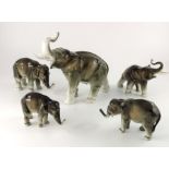 A set of five Royal Dux elephants