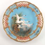 C Baldwyn, for Royal Worcester, a plate with pierced panels, circa 1902, with a group of swans