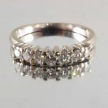 An 18ct gold diamond half eternity ring