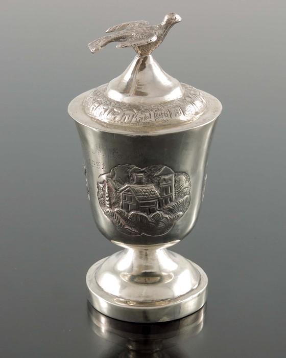 A Chinese export silver egg cup and cover