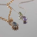 Two 9ct gold diamond and gem-set pendants, with chains