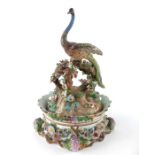 A French porcelain florally encrusted figural ink stand and cover