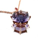 An 18ct gold amethyst and ruby pendant, with chain