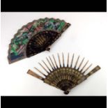 Two fans, a mid- 19th century Chinese Mandarin fan, Qing Dynasty, the monture of wood, lacquered in