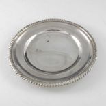An Edwardian silver trencher plate, Elkington and Co., London 1904