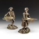 A pair of silver plated figural salts, circa 1890, modelled as standing 18th century figures