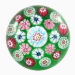 Clichy, patterned millefiori paperweight, central blue, white and red cane, surrounded by pink and w