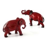 Charles Noke for Royal Doulton, two Flambe Elephant figures