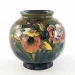 William Moorcroft, a Flambe Orchid vase, circa 1935, spherical form