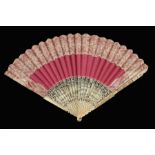 λ Two 18th century fans, an 18th century fan with bobbin lace adorns a rose-pink silk leaf, the fan