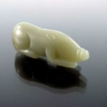 A Chinese carved jade pendant, modelled as a pig