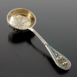 An Imperial Russian silver gilt and cloisonne enamelled tea strainer