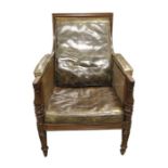 A French Empire style Bergere walnut library armchair
