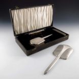 A George VI silver backed brush and mirror set, Charles S Green and Co., Birmingham 1939