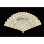 Two fans, a black Chantilly lace fan, circa 1890s, the leaf applied onto cream silk, and backed with