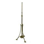 An Arts and Crafts brass adjustable standard lamp