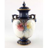 A Royal Worcester twin handled vase and cover