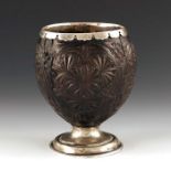 A George III silver mounted coconut cup