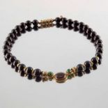 Deakin & Francis, a 9ct gold garnet bead and tsavorite garnet necklace