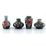 William Moorcroft, four small Orchid vases