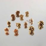 Six pairs of gold stud earrings