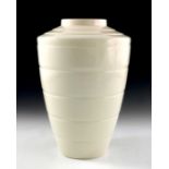 Keith Murray for Wedgwood, a Champagne glaze creamware vase, designed circa 1934