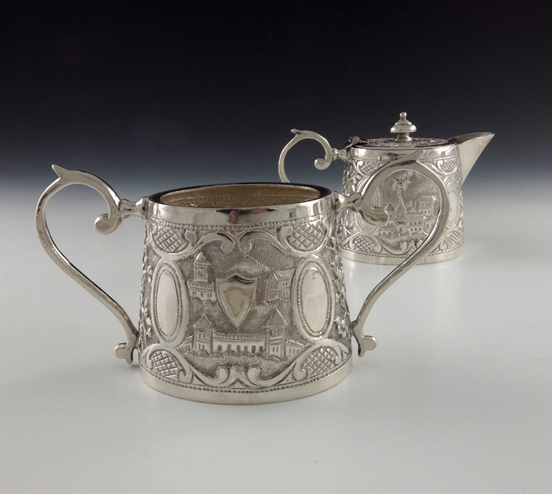 A Chinese Persian style white metal teapot and sugar bowl