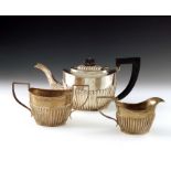 A George V silver three piece tea set, A J Zimmerman, Birmingham 1919