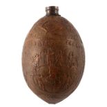 A 19th century carved coconut bugbear flask