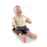 A Gebruder Heubach bisque headed doll, circa 1912