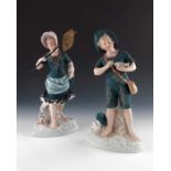 A pair of Gebruder Heubach bisque figures of seaside children